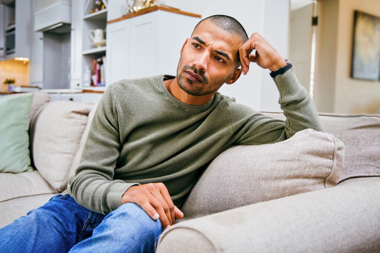 Shot of a young man relaxing at home