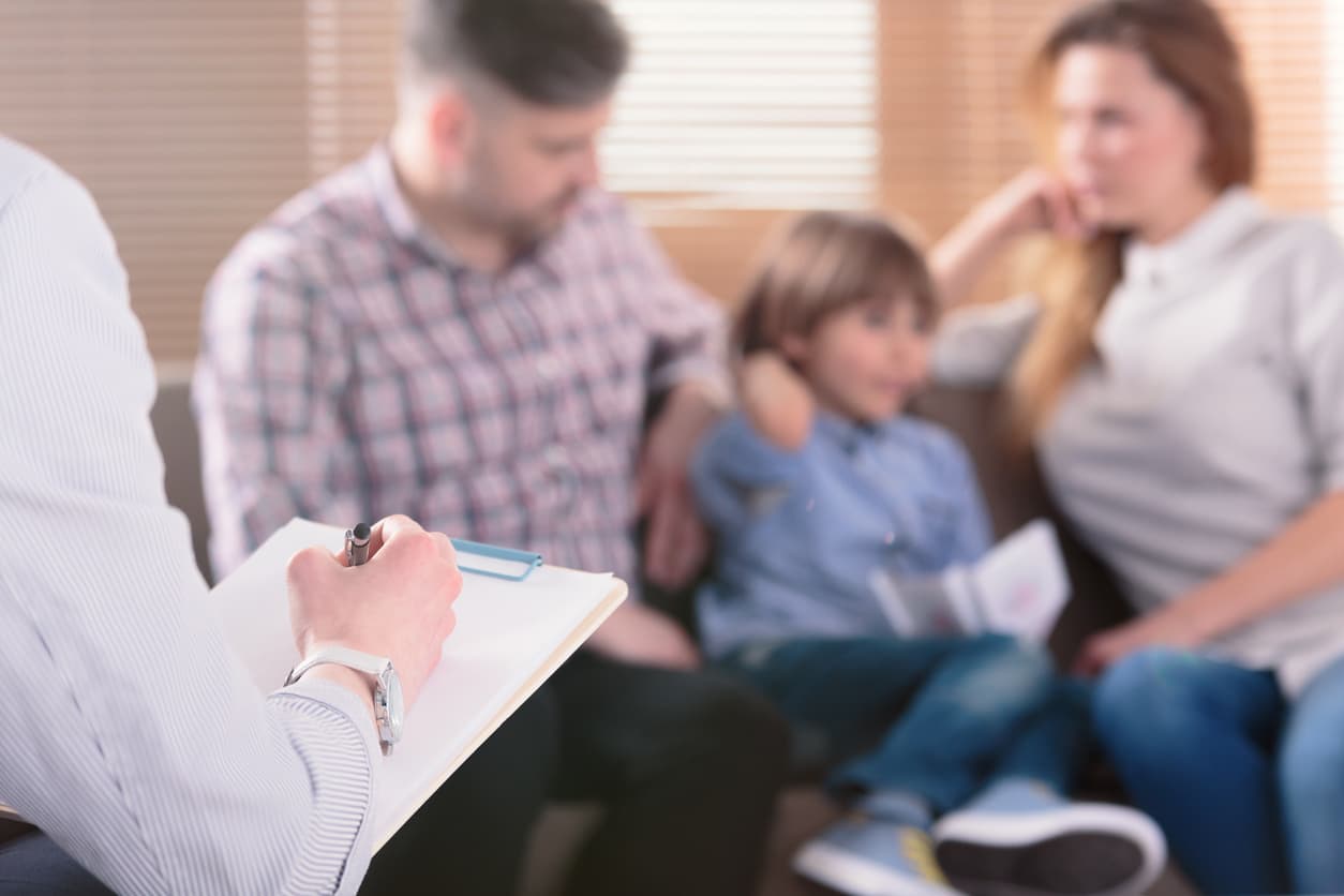 woman man and child with therapist