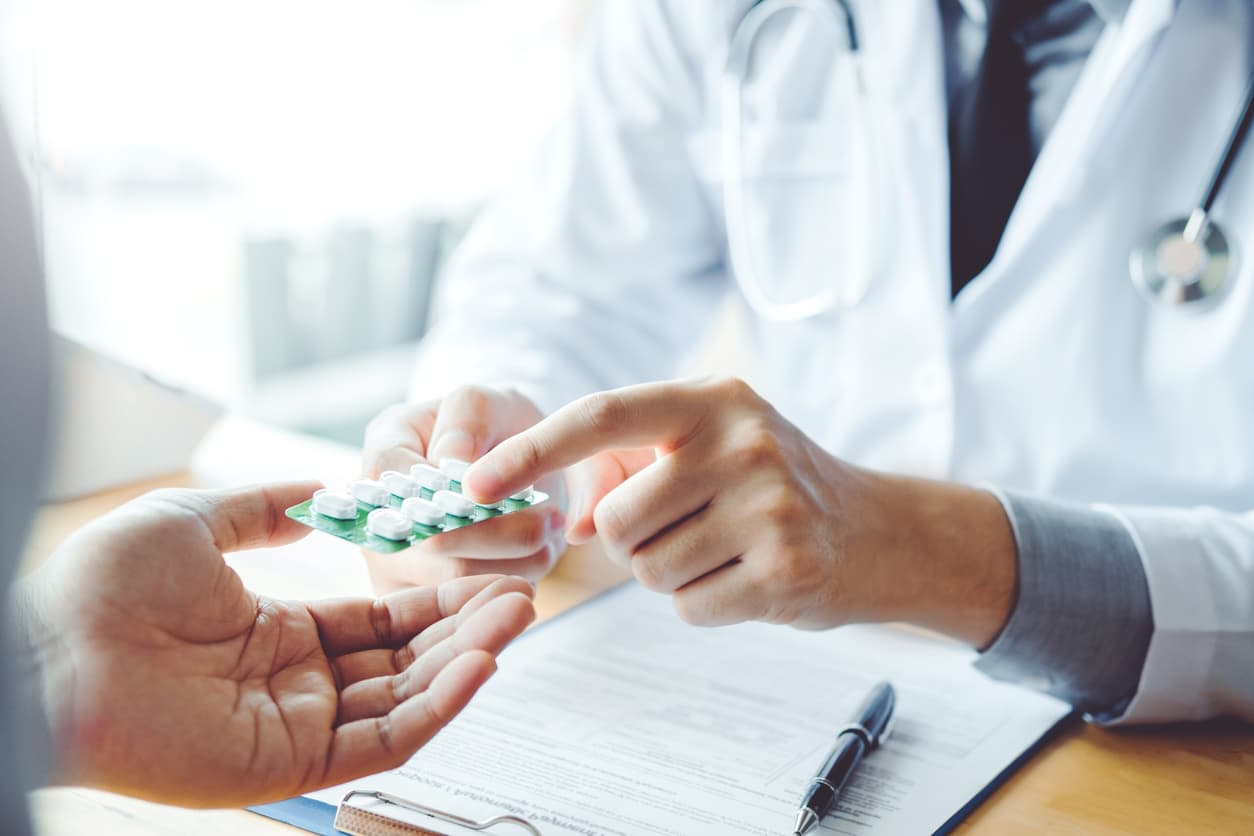 doctor recommending medications to patient