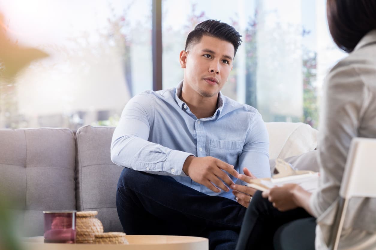 Attentive man listens to counselor