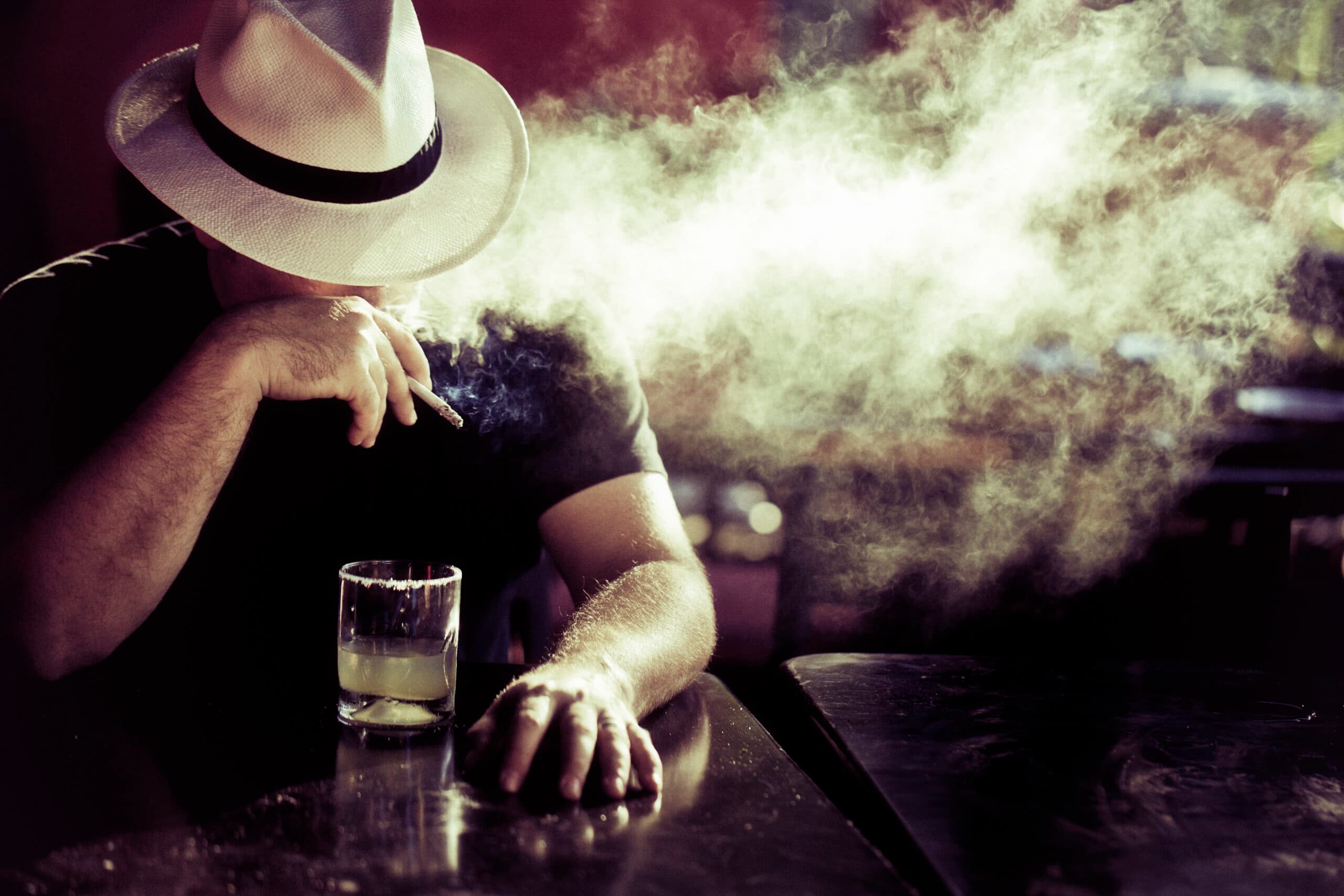 man smoking alcohol drink