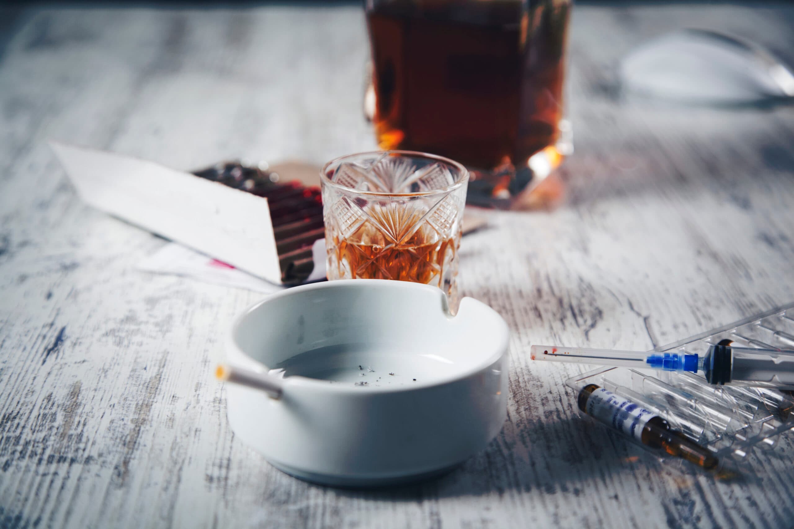 whiskey and heroin syringe liquor bottle