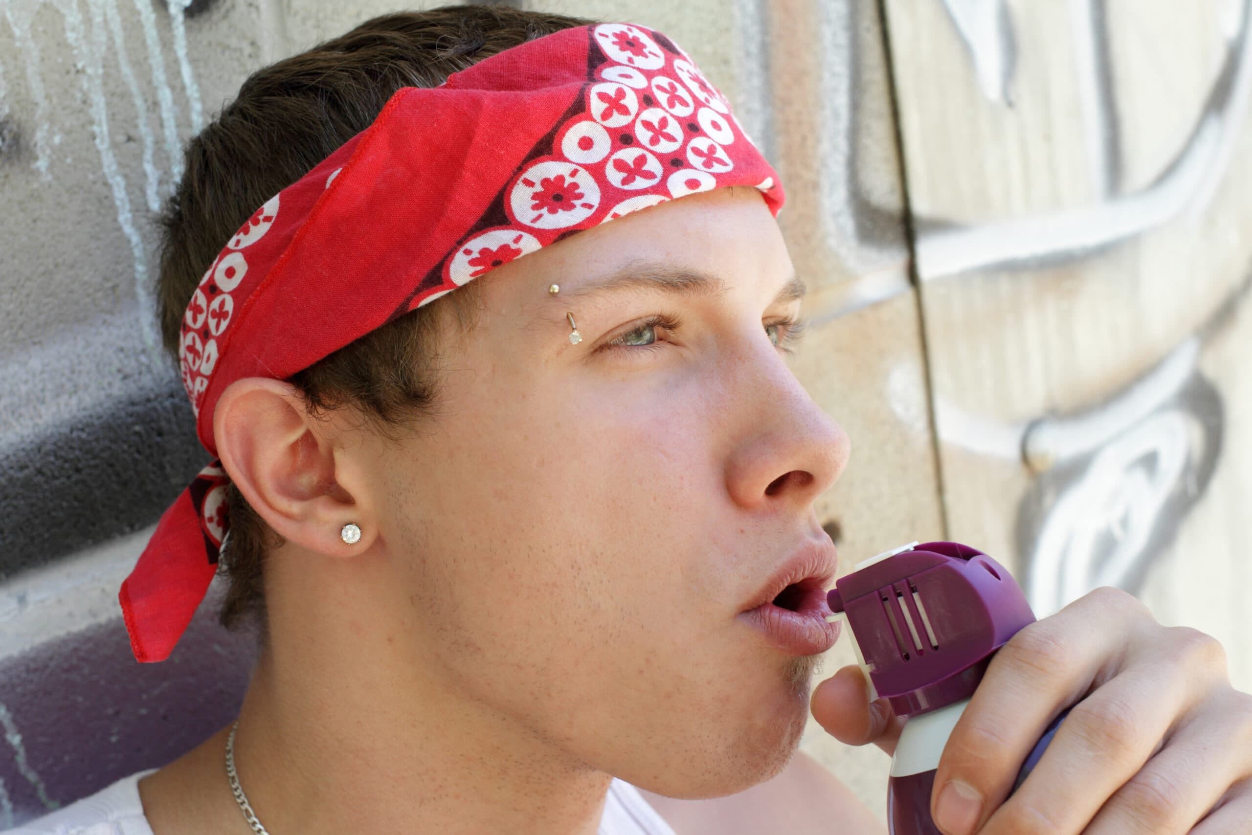 young man huffing inhalants