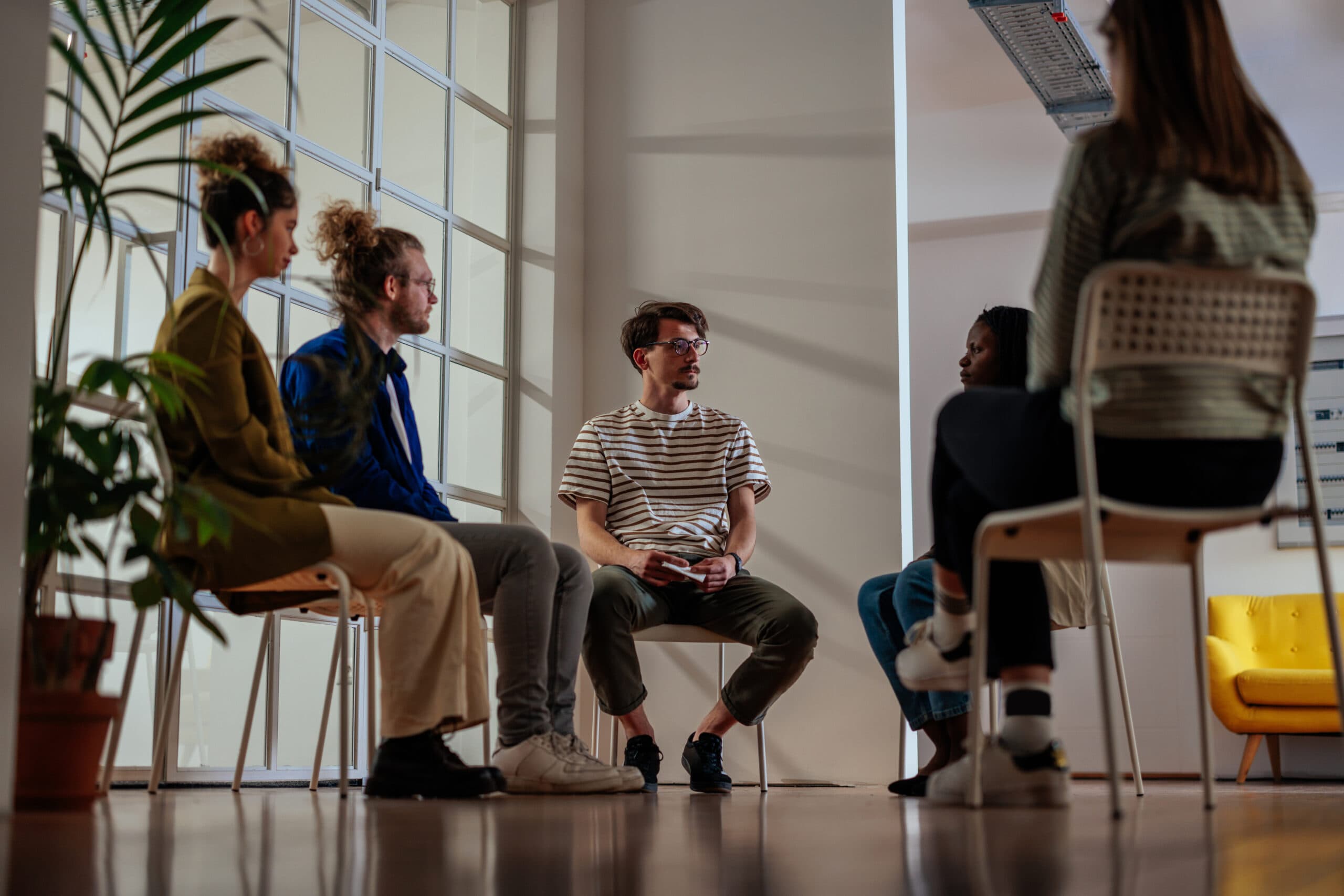 group of people in circle therapy treatment