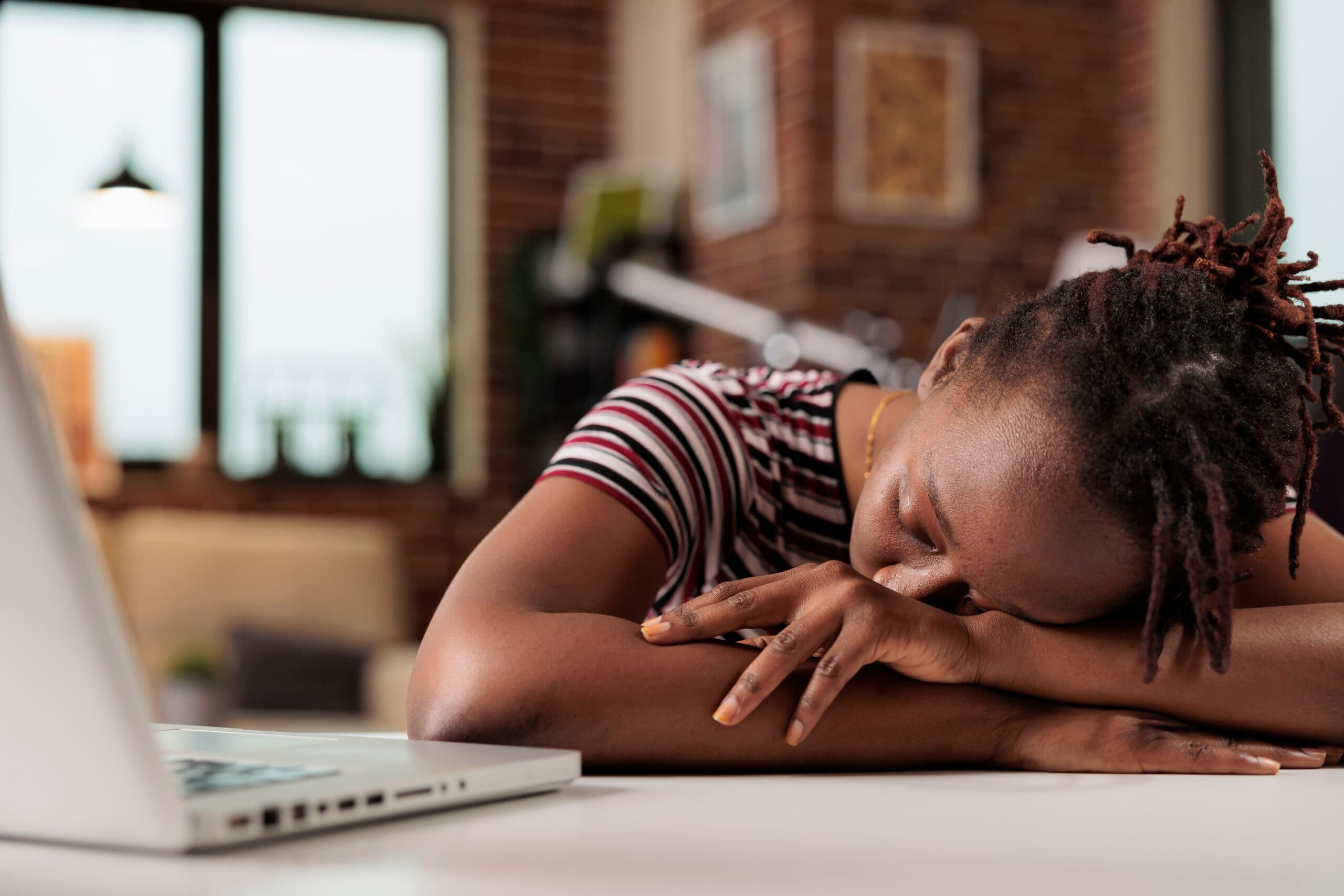 woman asleep at computer