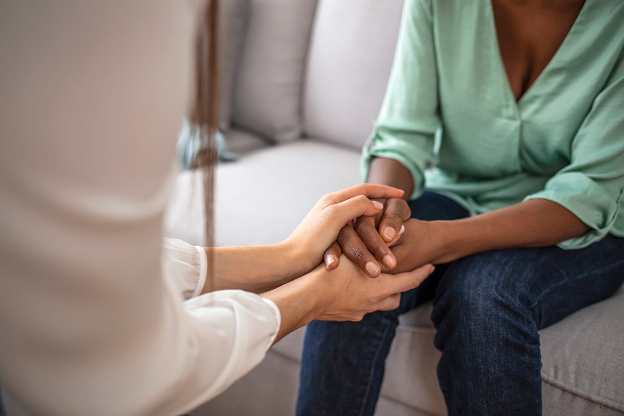 therapist holding hands with patient