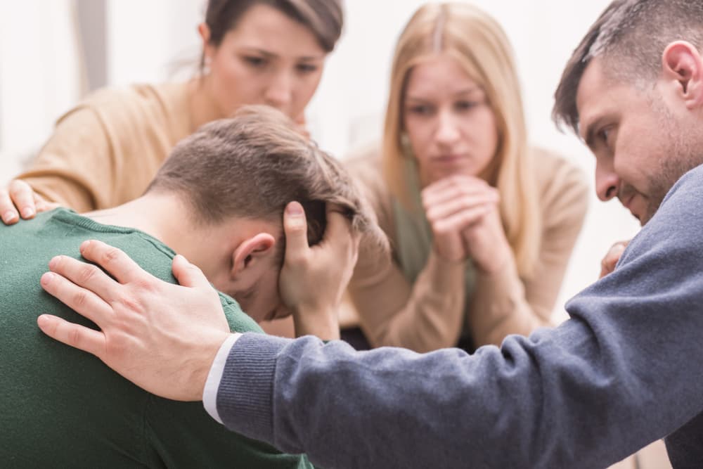 family embracing addict upset