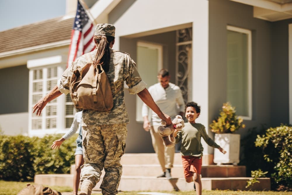 woman soldier reuniting with family