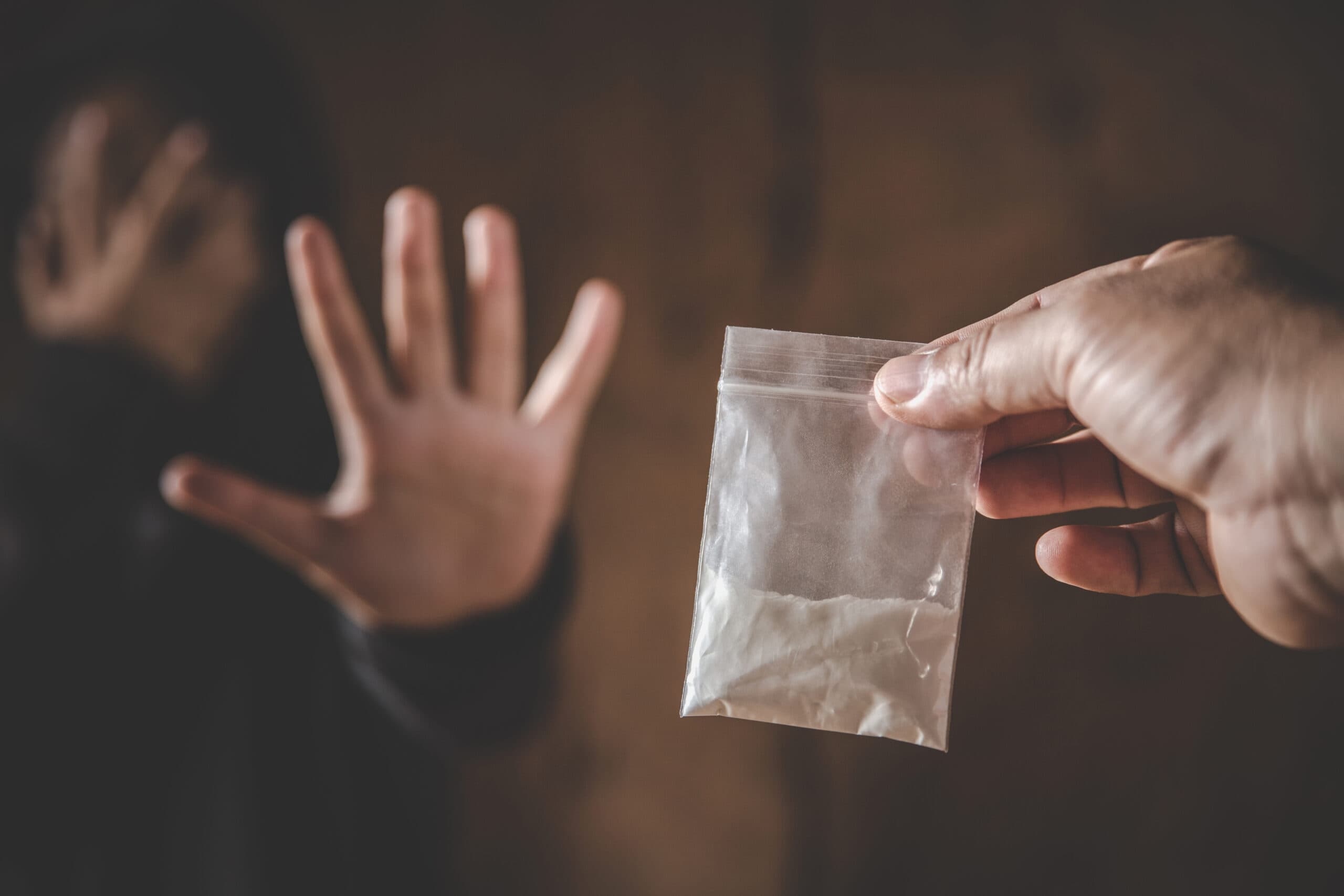 man refusing cocaine bag