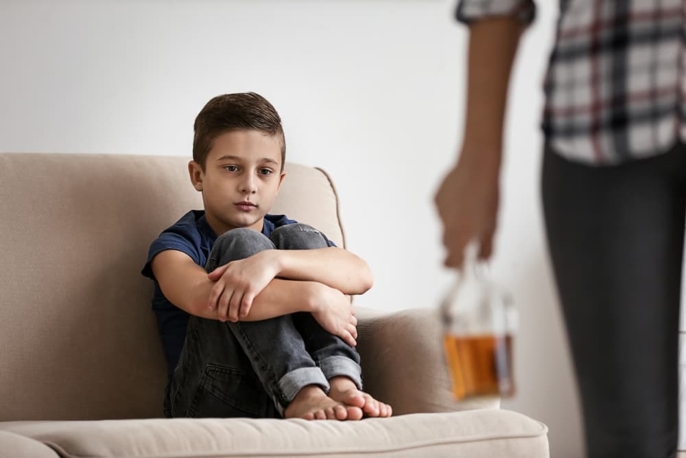 sad young boy with alcoholic father