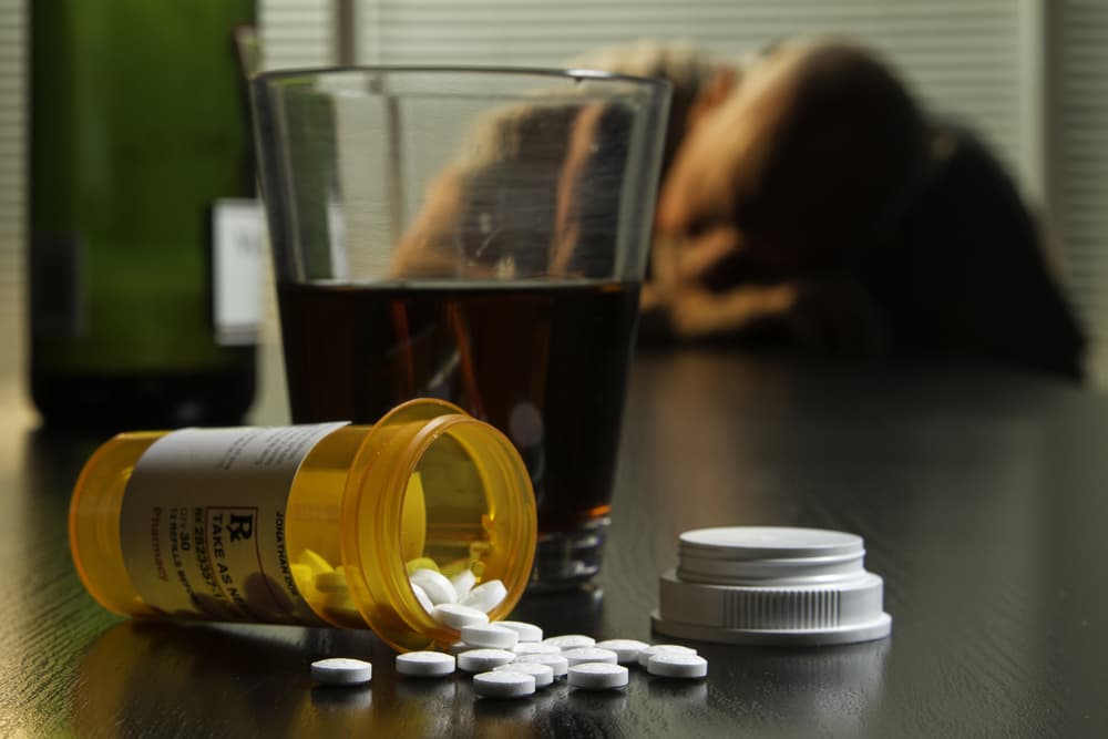 man sleeping after mixing antibiotics and alcohol