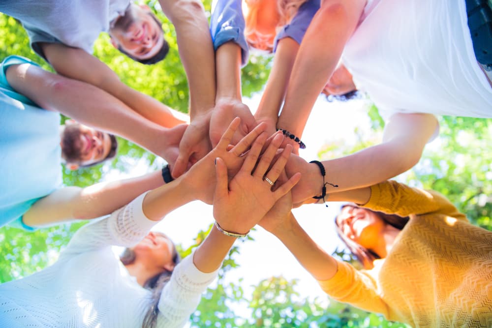 group of friends hands circle