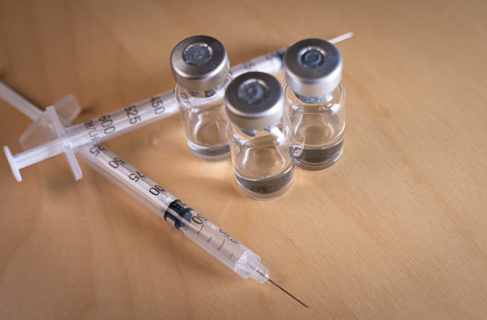 liquid heroin vials and needles