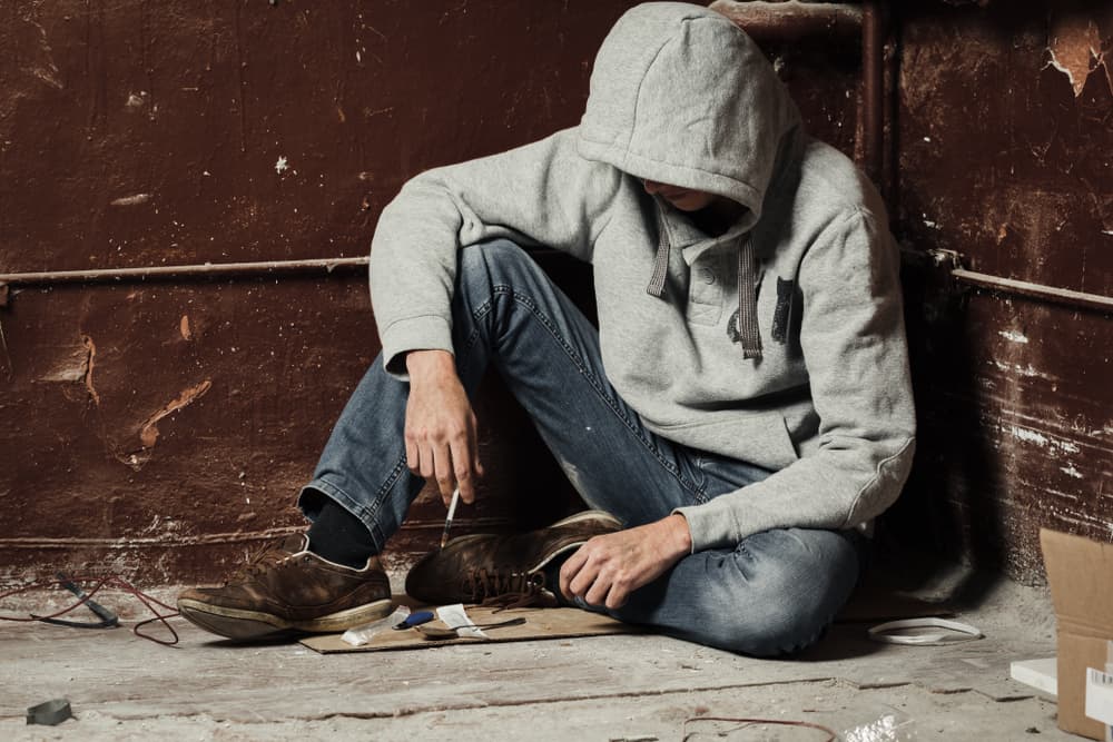 man drug addict with syringe