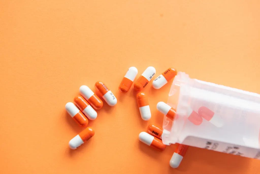 white and orange pills