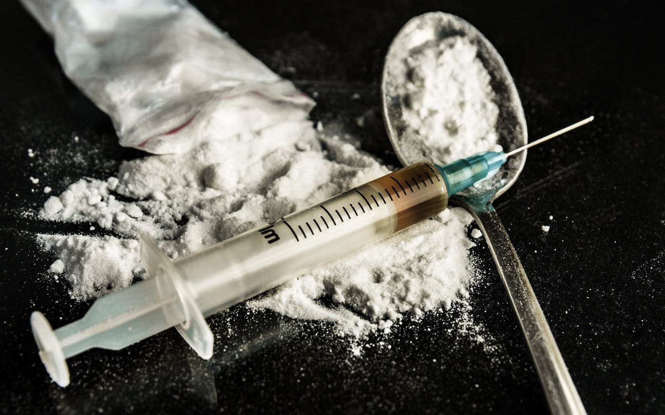 powder drugs and syringe and spoon