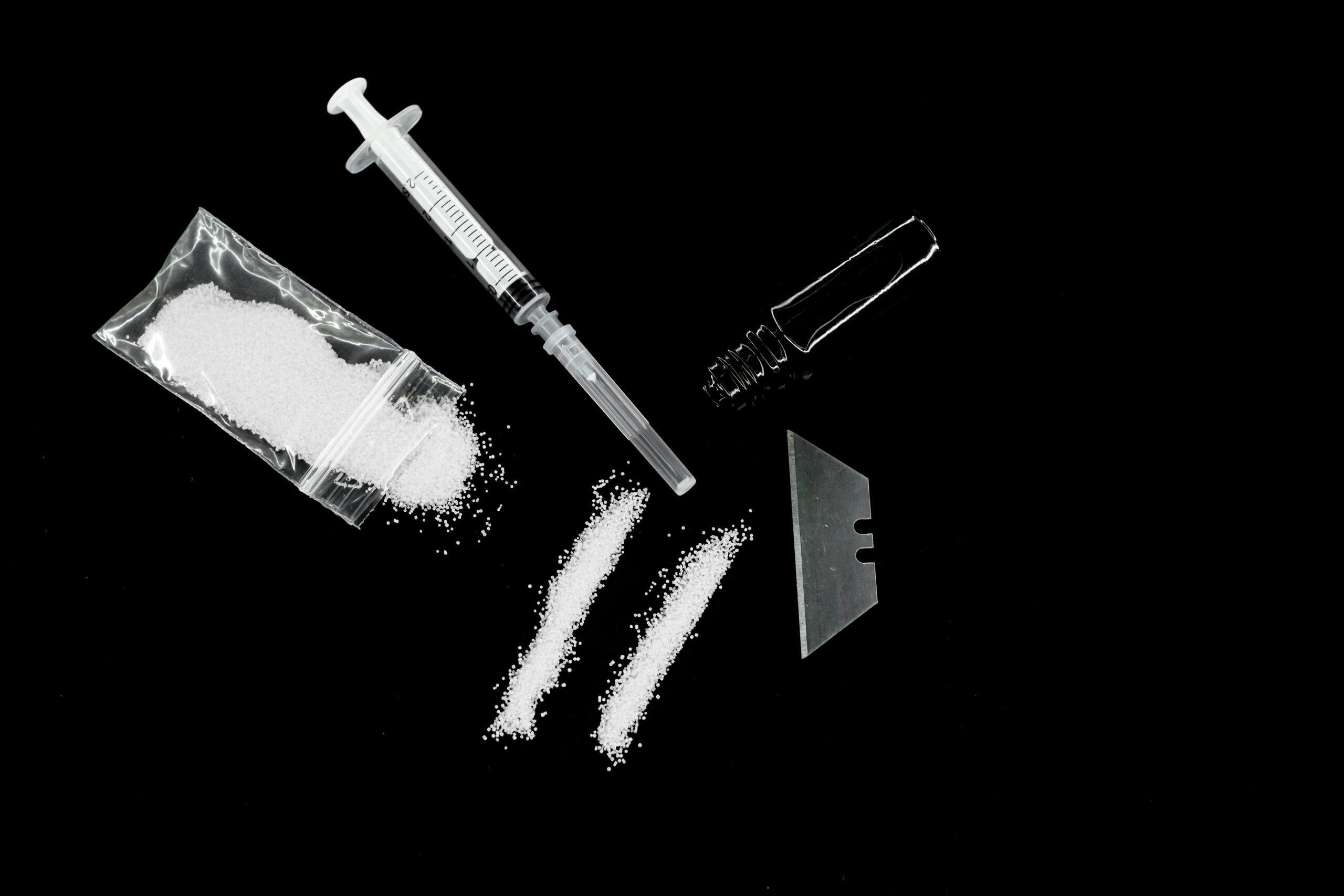 cocaine in bag, lines, syringe, razorblade
