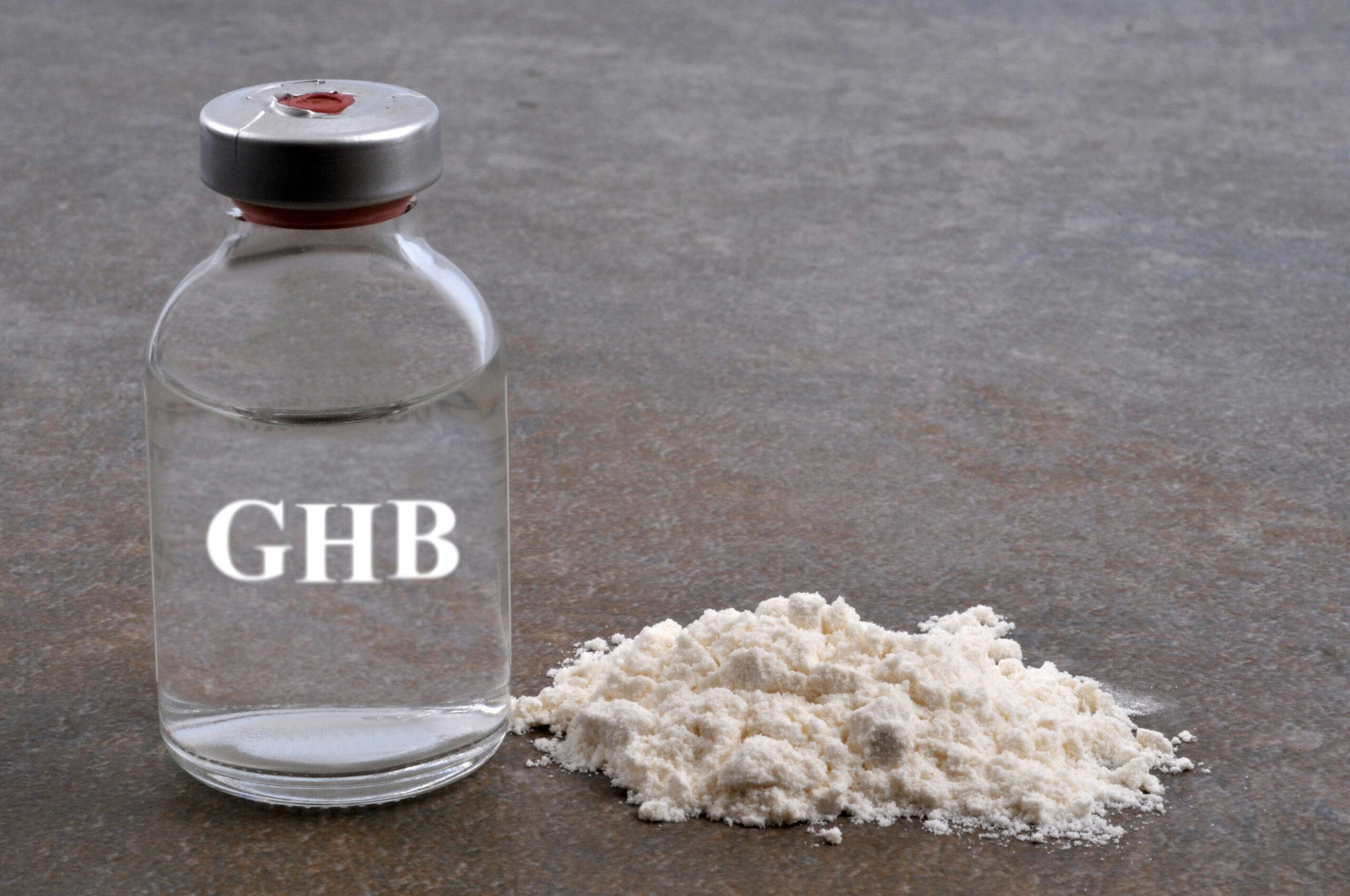clear liquid bottle of ghb and white powder ghb