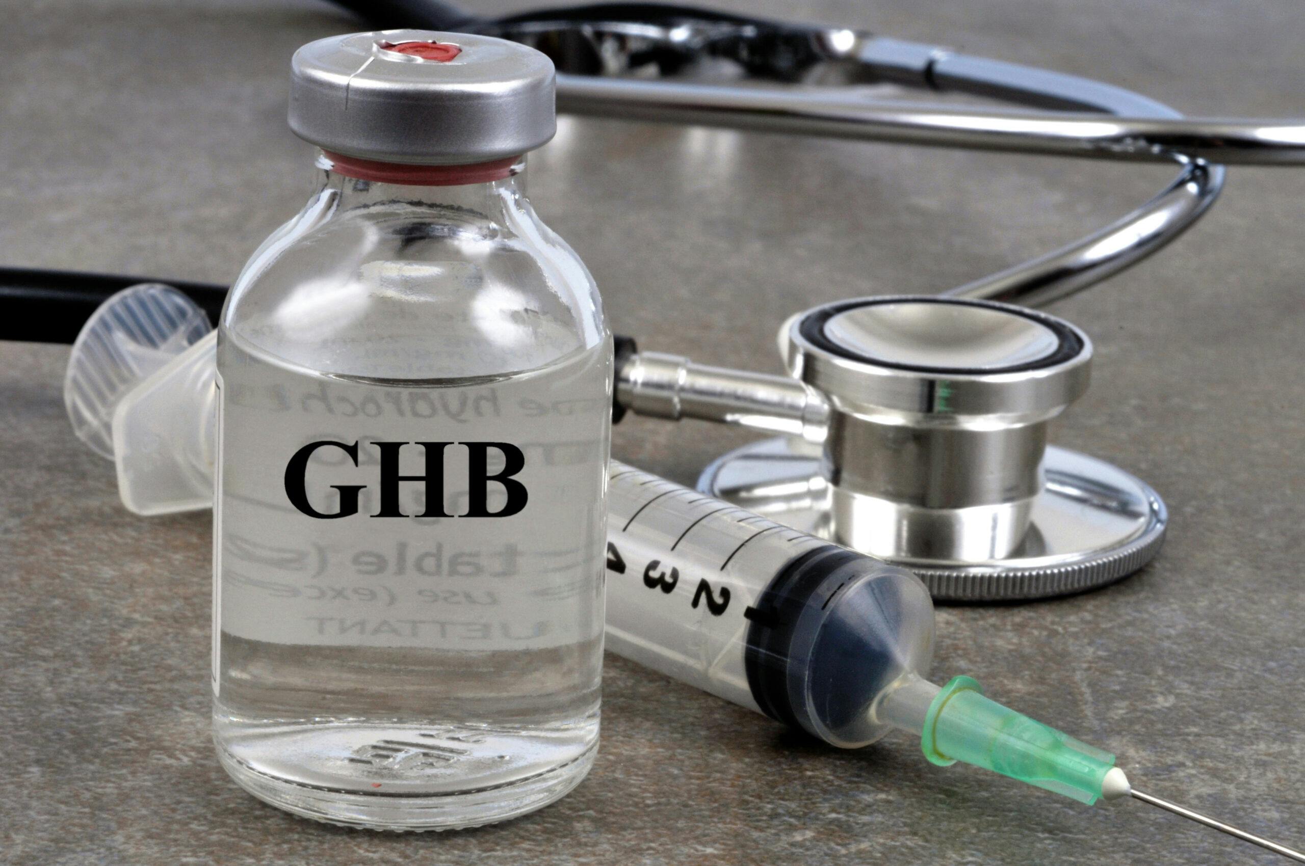 ghb vial with hypodermic needle and stethoscope