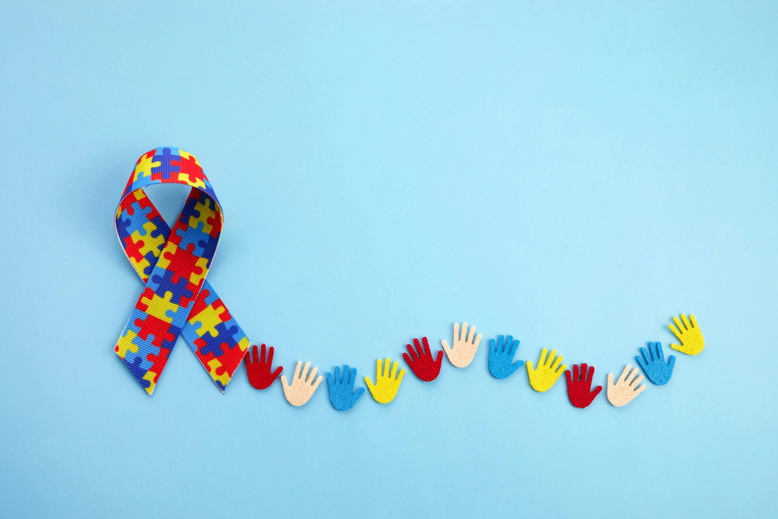 autism awareness ribbon and hands