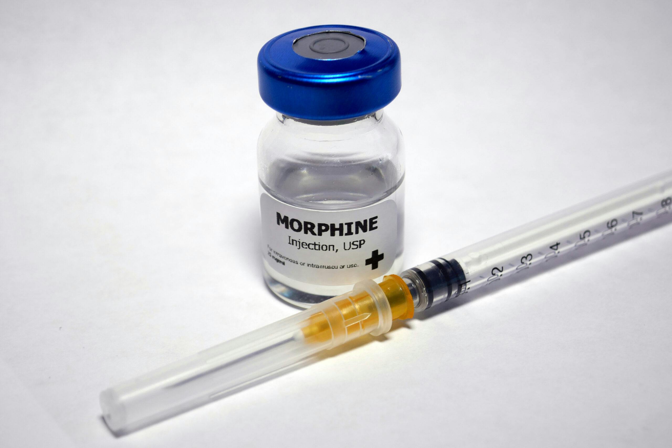 vial of morphine with hypodermic needle