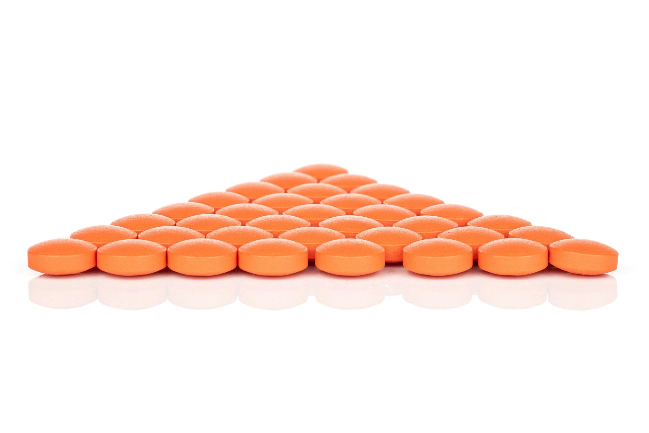orange pills in triangle shape