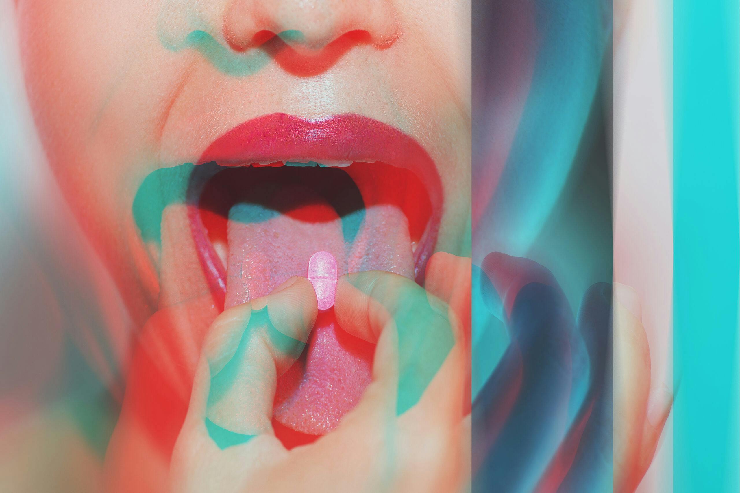 psychedelic woman taking ecstasy pill