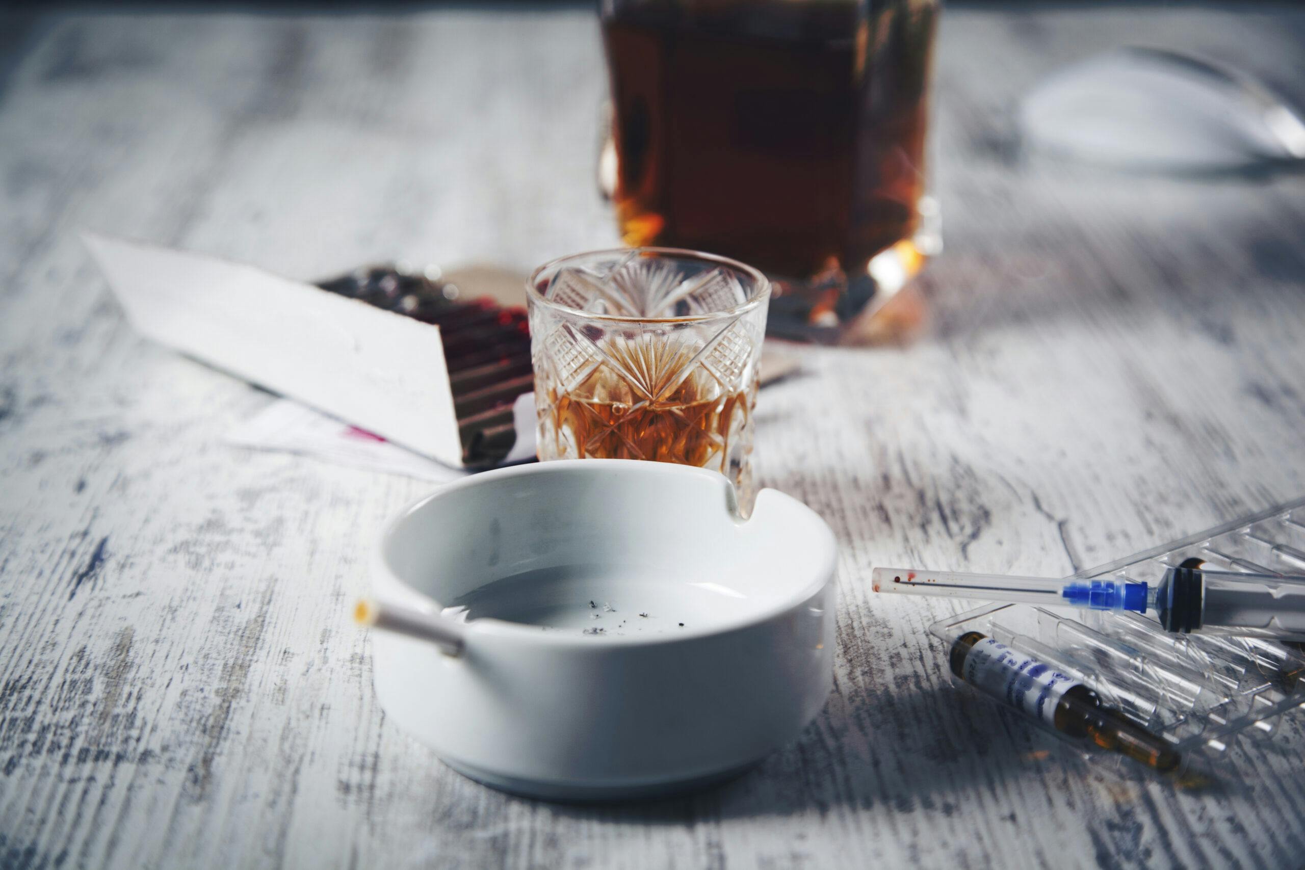 whiskey and heroin syringe liquor bottle