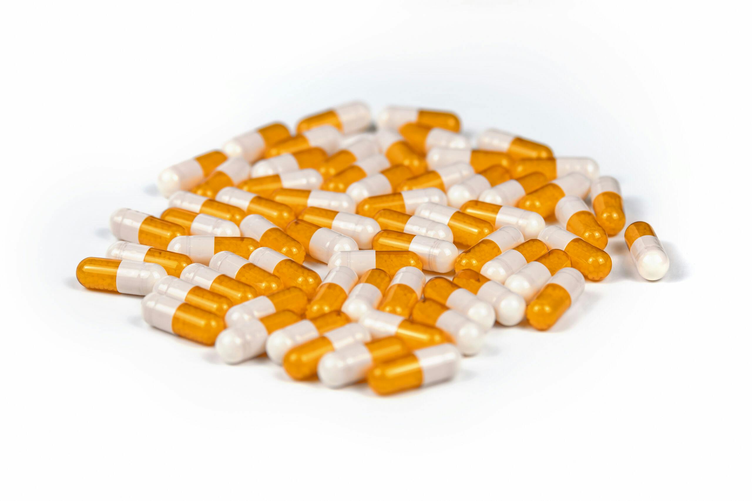 orange white adderall capsules