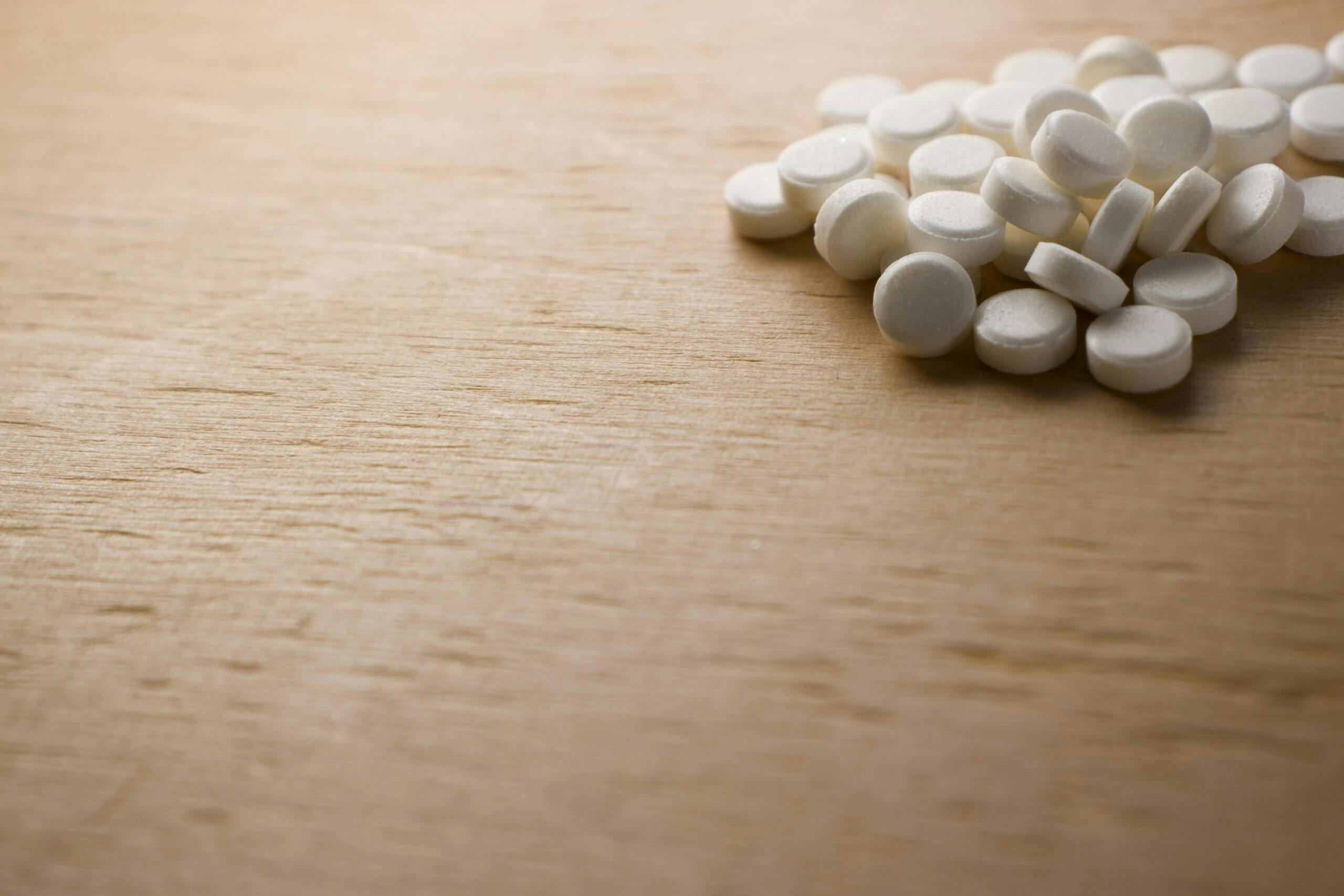 white ativan pills on wooden table