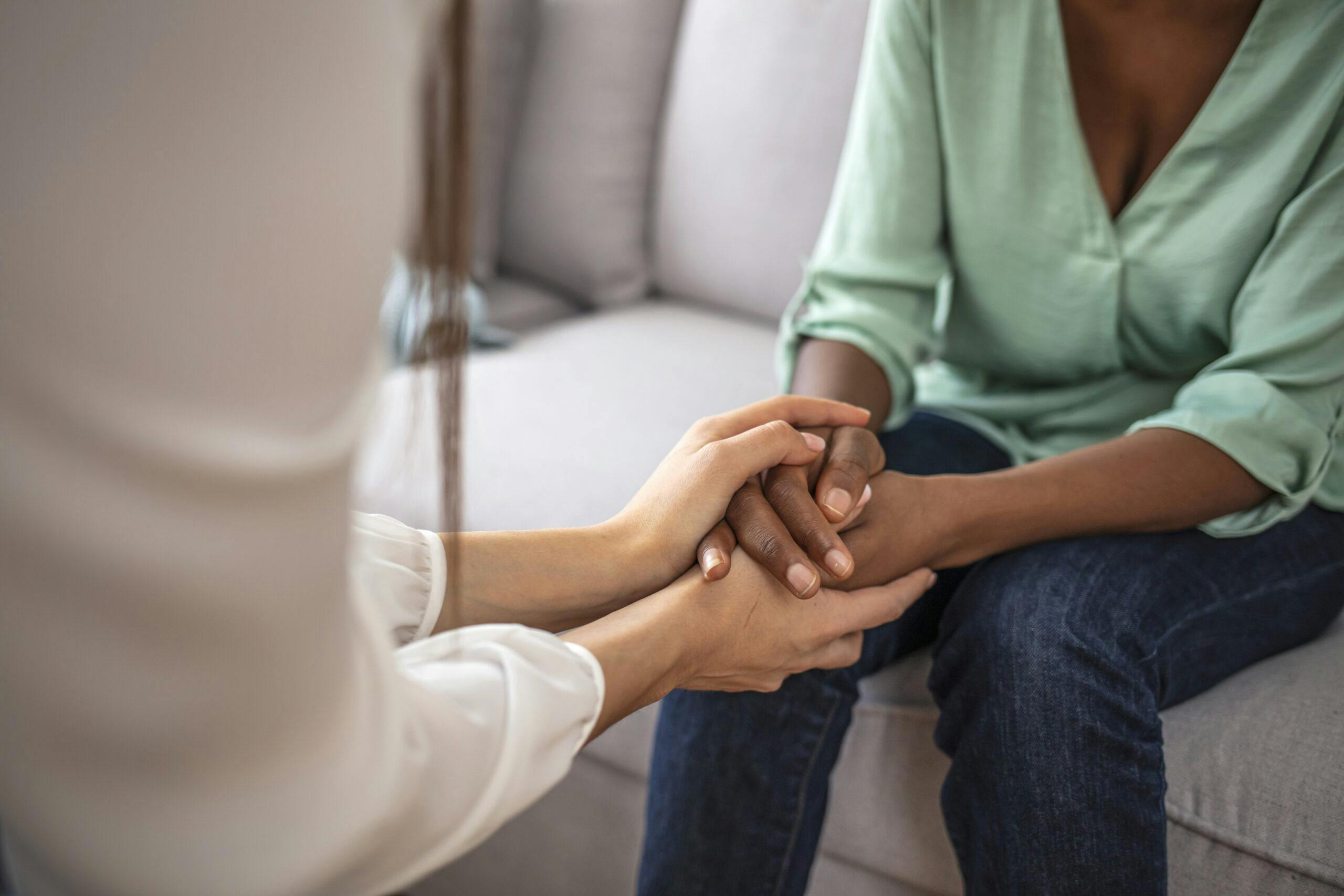 therapist holding hands with patient