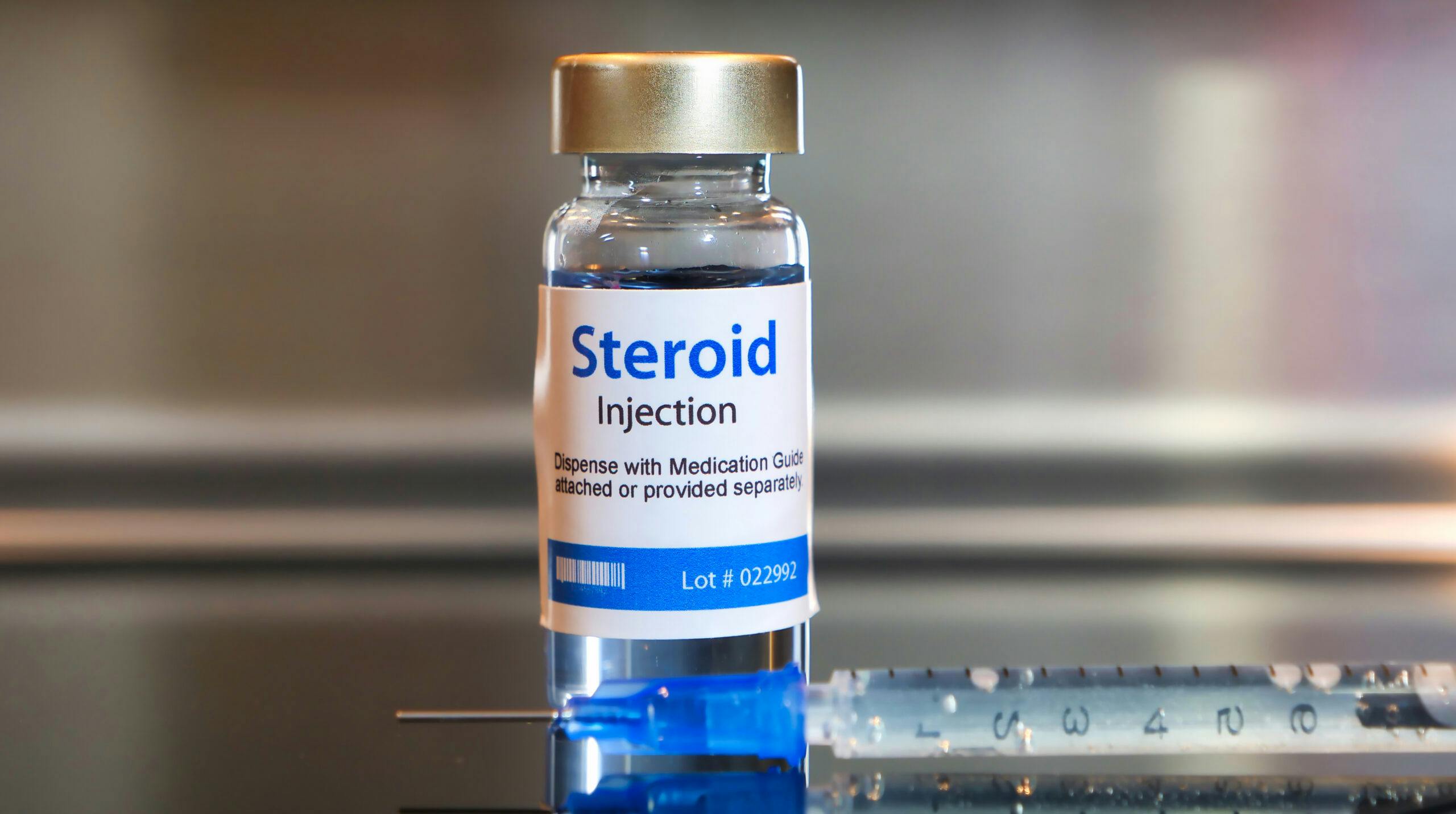 steroids bottle and needle
