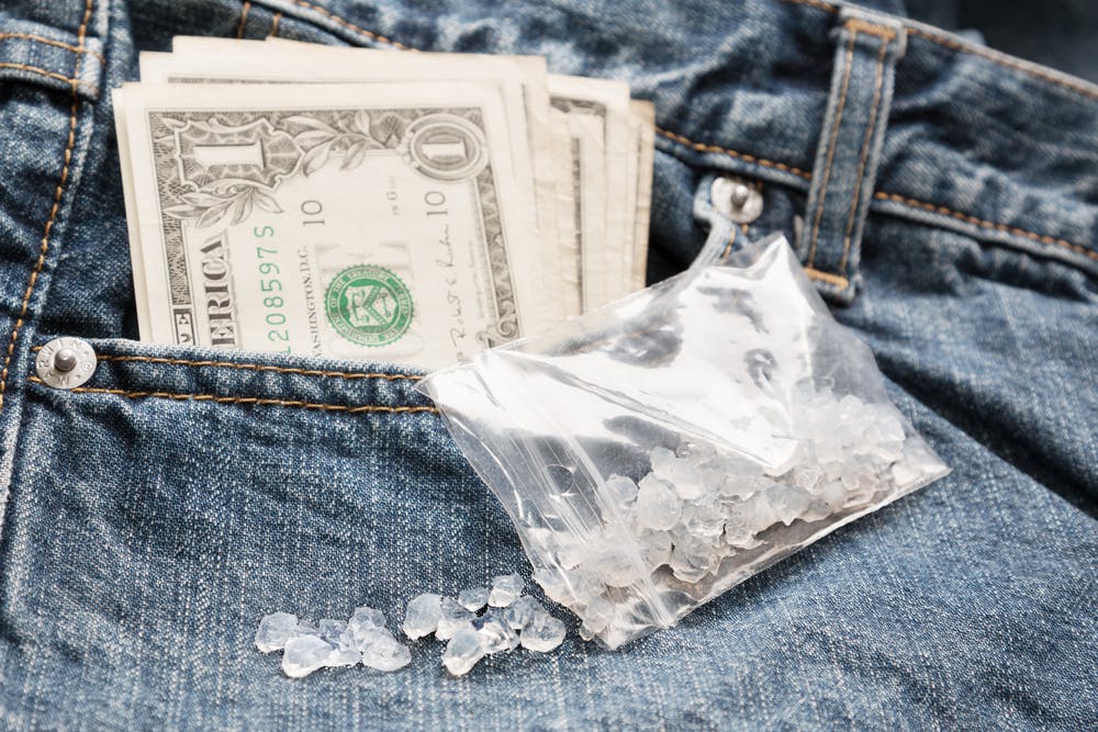 crystal meth bag with money in jeans