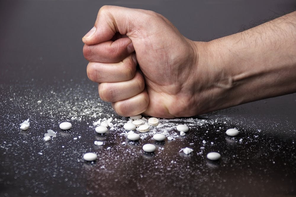 fist on drugs pilled crushed up