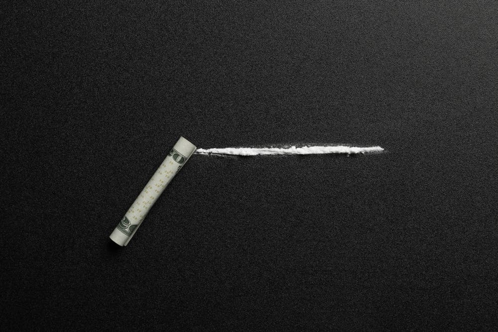 line of cocaine and rolled bill