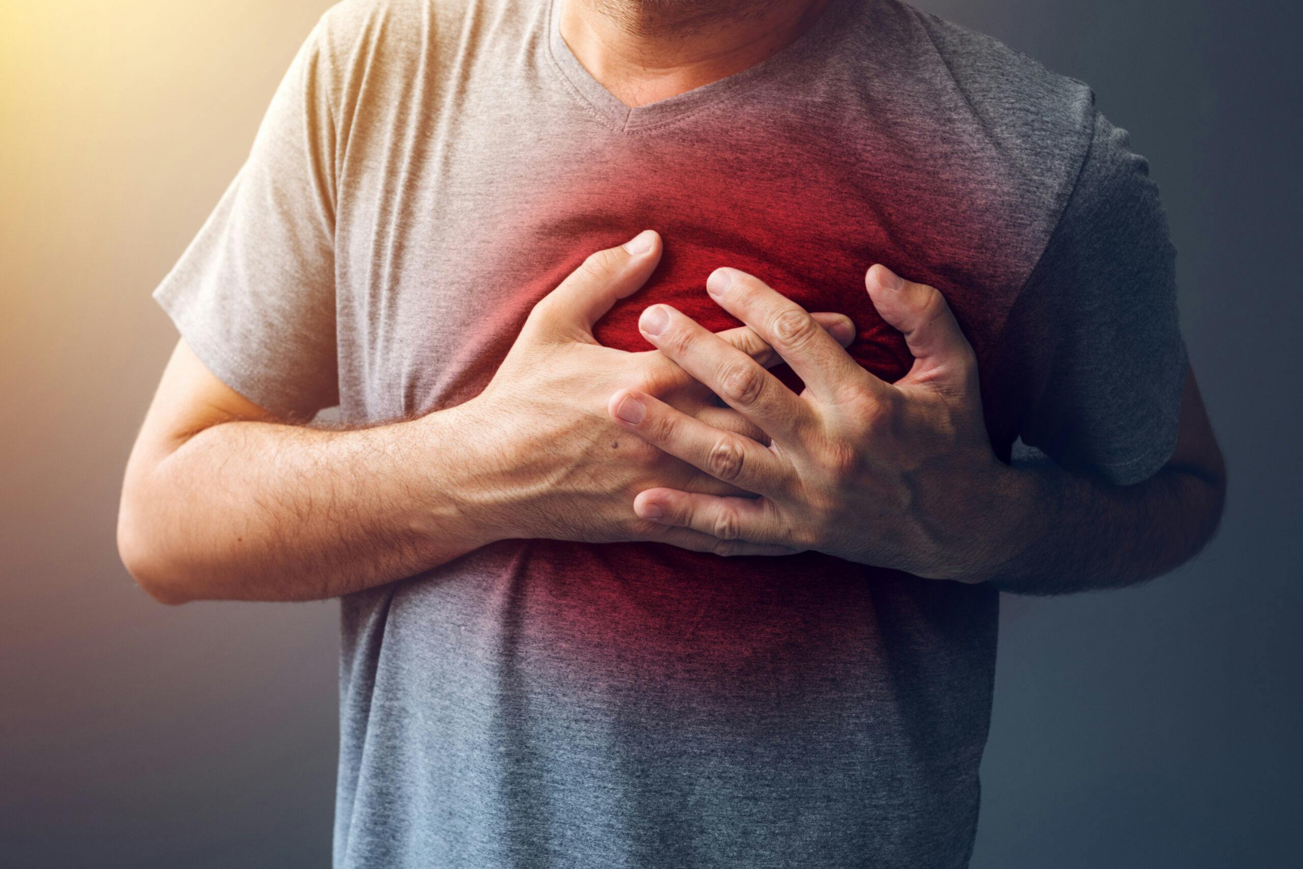 man grabbing heart chest problems