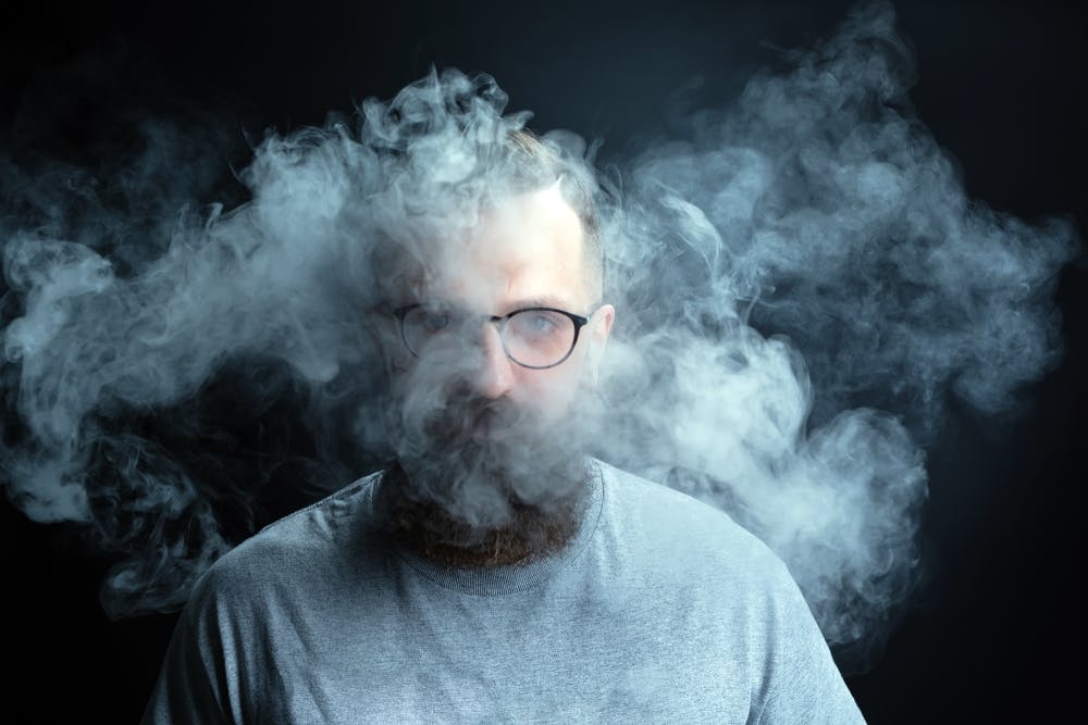 man surrounded by meth smoke