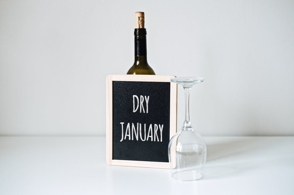 dry january sign upside down wine glass bottle