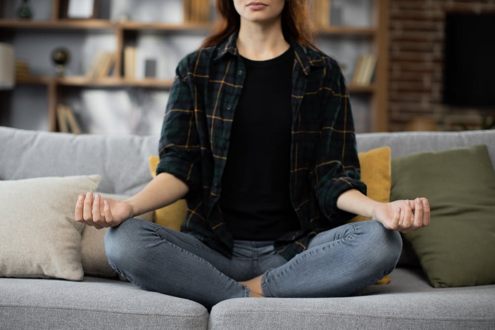 young woman in meditation position