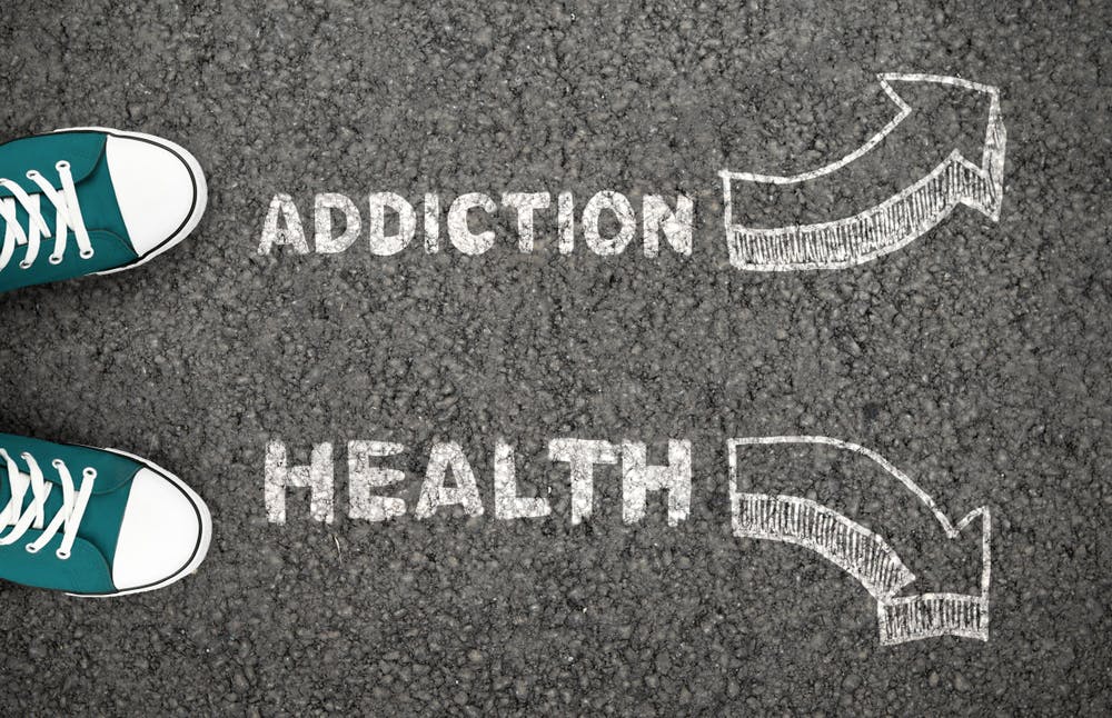 Man On Crossroad Choosing Addiction Or Health